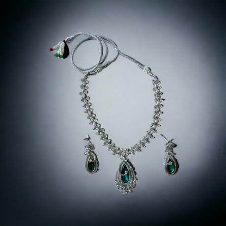 Silver necklace set with green stone